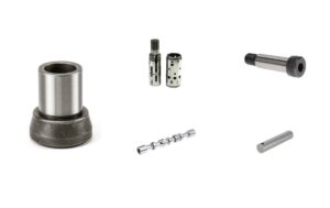 Centerless-ground parts including a bushing, valve spools, a shoulder bolt, and a pivot pin