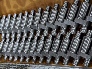 Rack of finished splined shafts ground at Custom Production Grinding